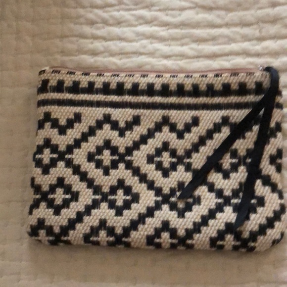 Mango clutch. Textured geometric pattern. Zip top w/ black grosgrain ribbon pull - Picture 3 of 11